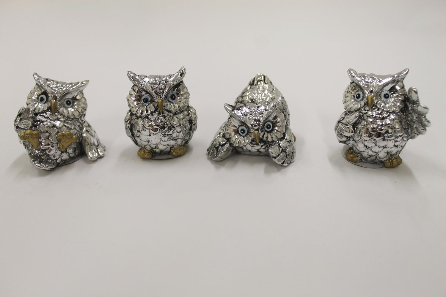 A set of four little Owls