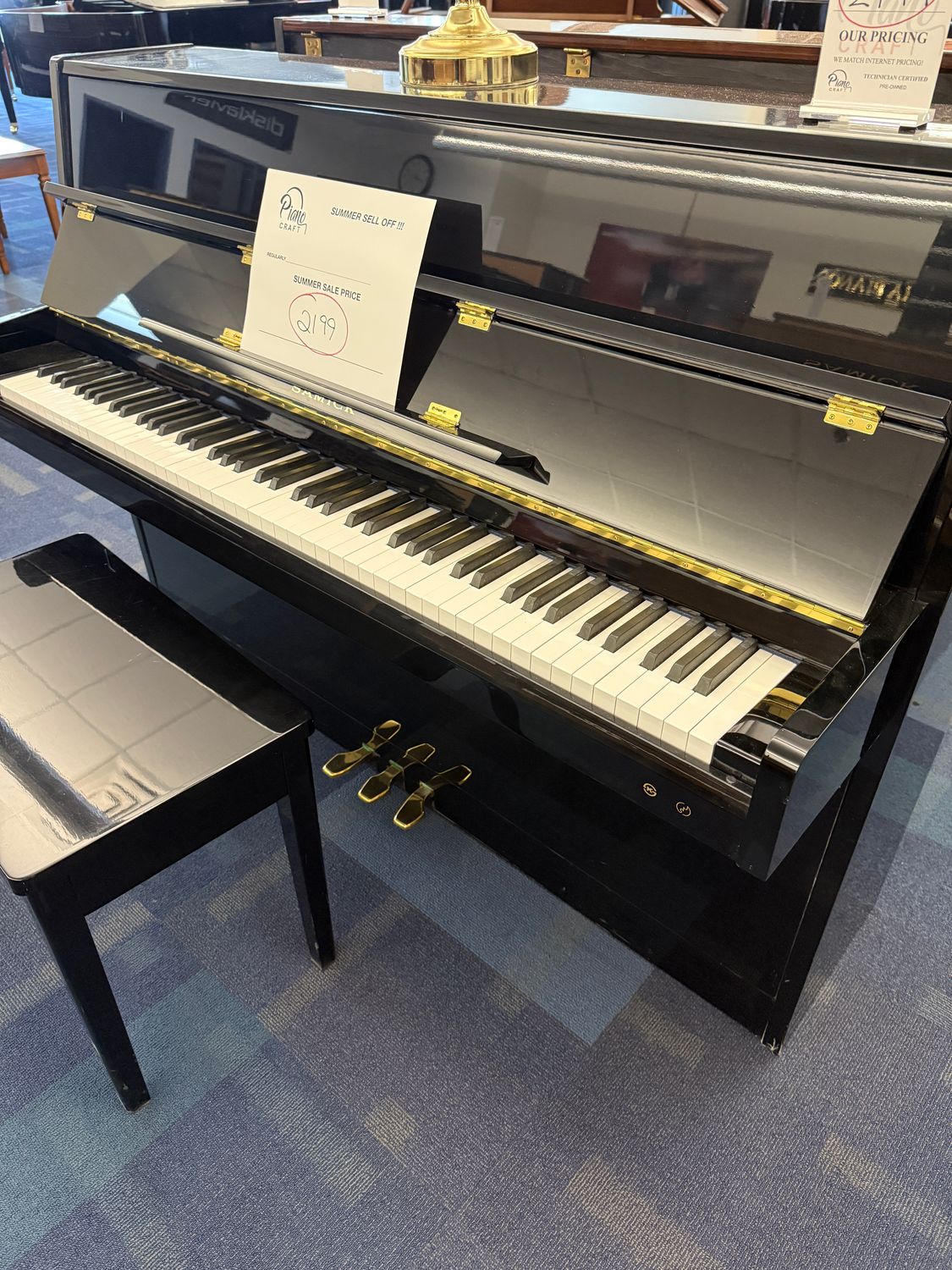 Samick console in Ebony High Polish.
