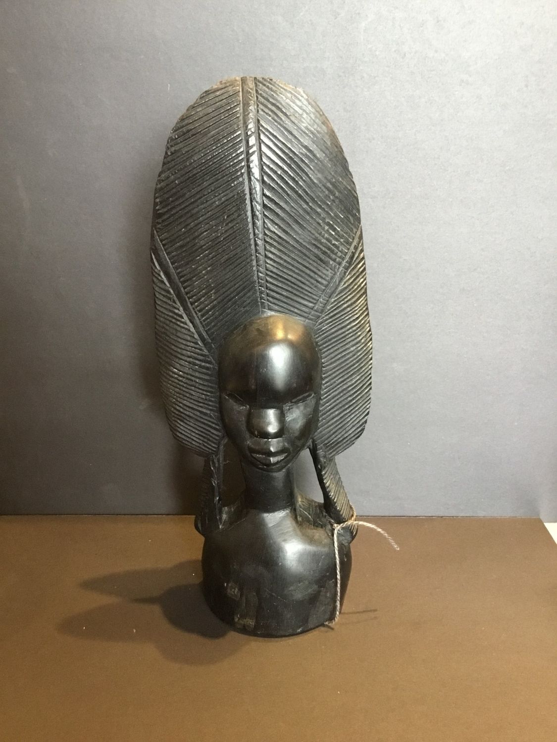 Women in headdress wooden Carving