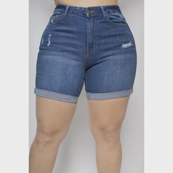 Plus-size distressed denim shorts with cuffed hems and stretch fabric