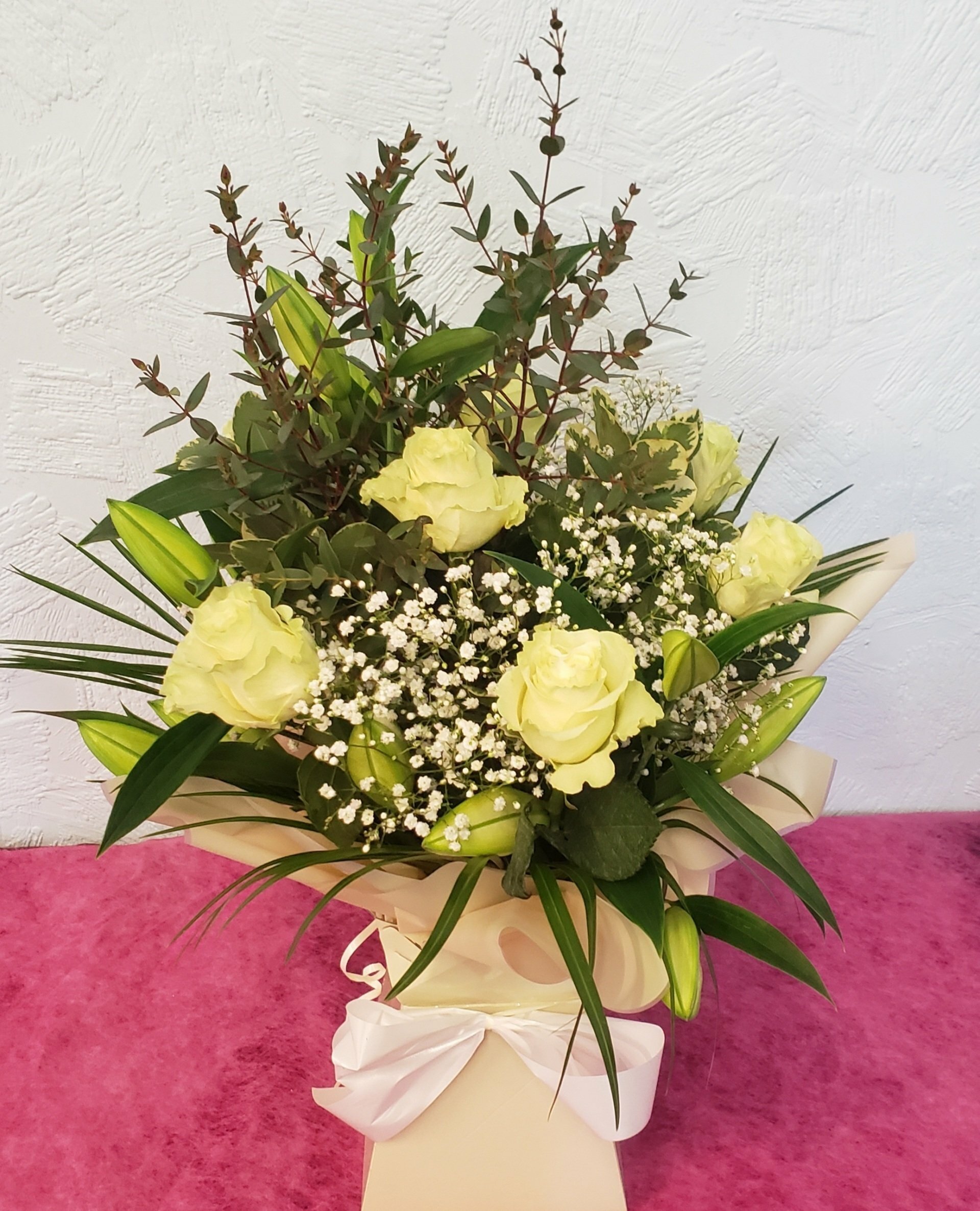 Christmas Hand tied  Lily and rose Bouquet with seasonal foliage for Local delivery starting from £57.50