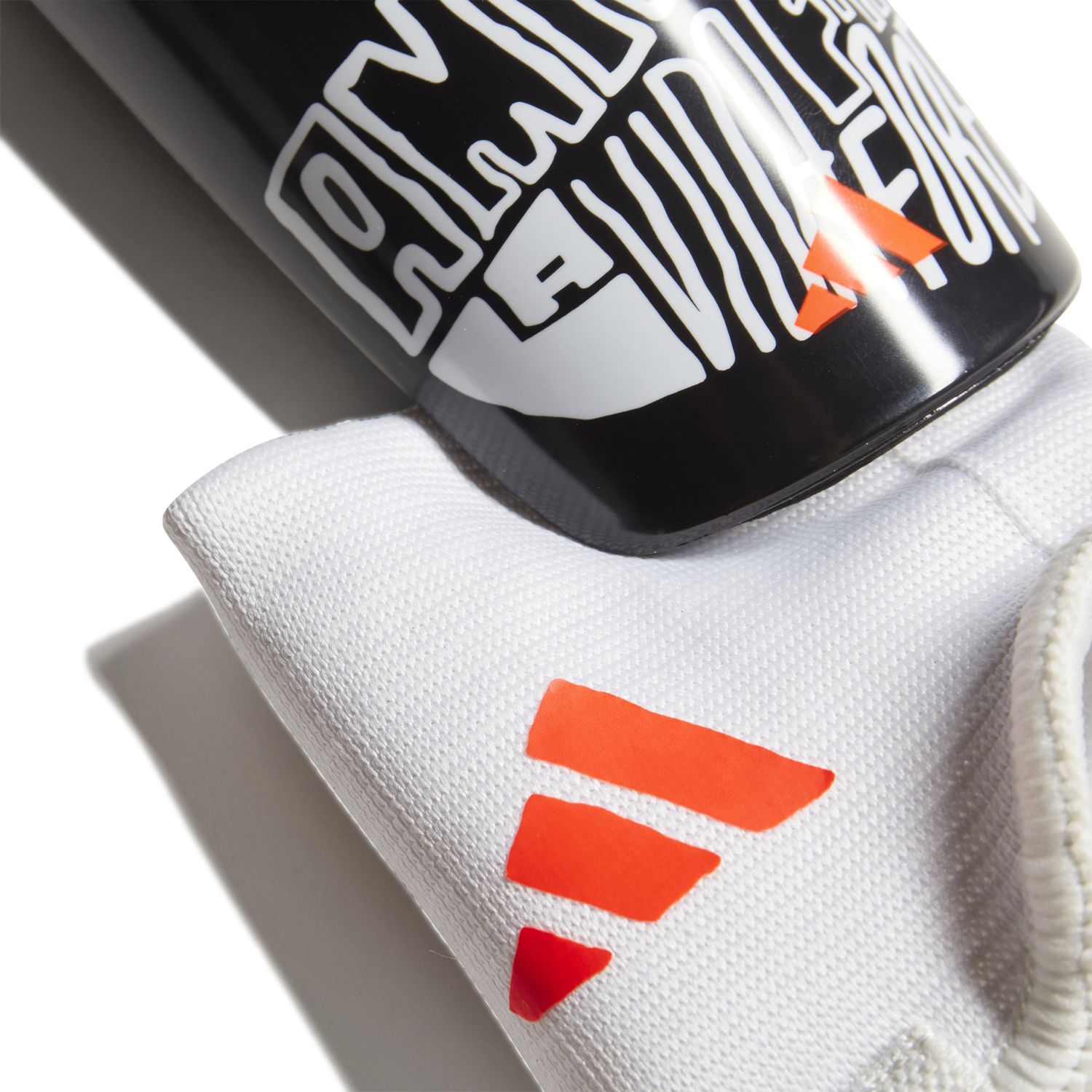 MESSI MATCH JUNIOR SHIN GUARDS (BLACK/WHITE/ORANGE)