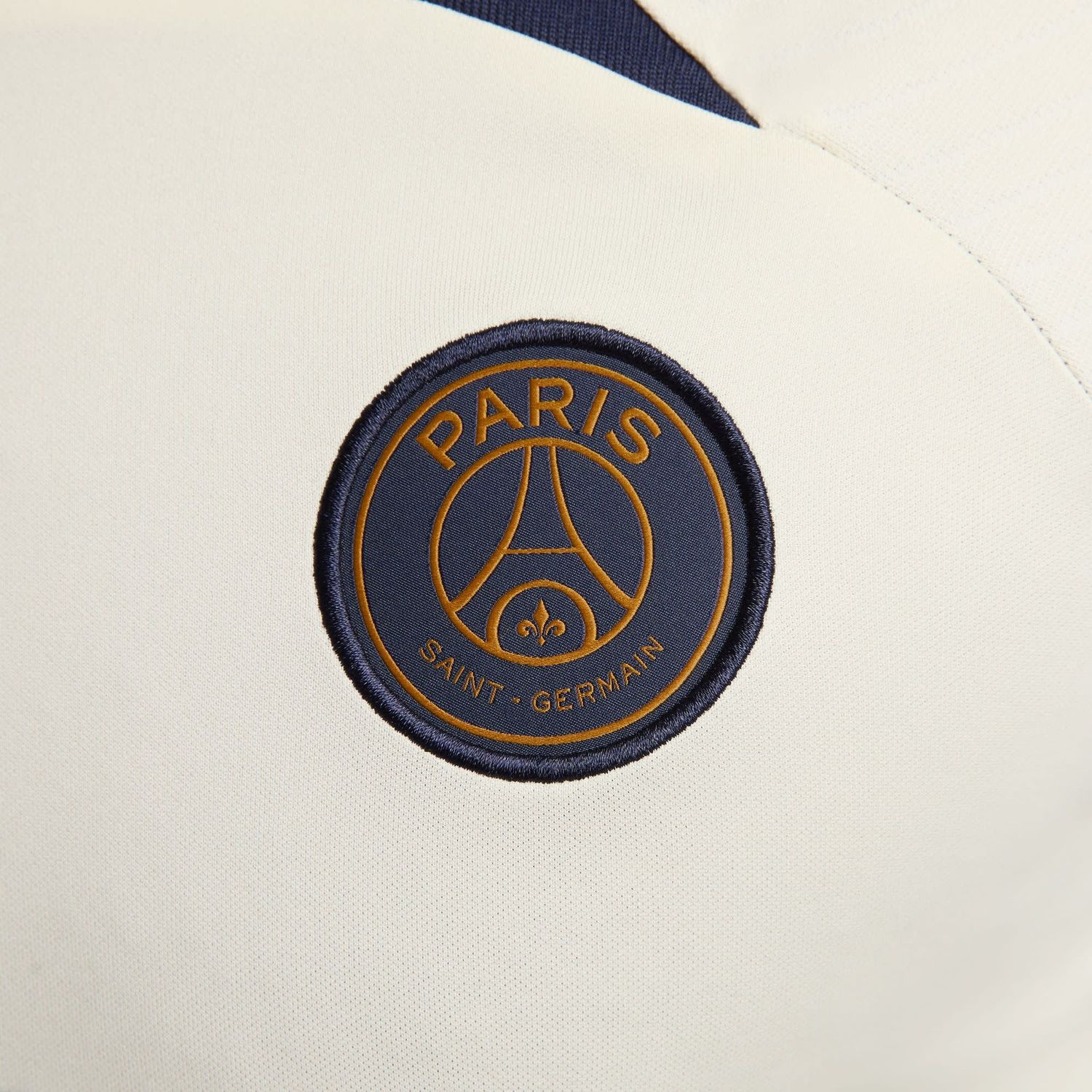 PSG 23/24 STRIKE TRAINING JERSEY (SAND/NAVY)