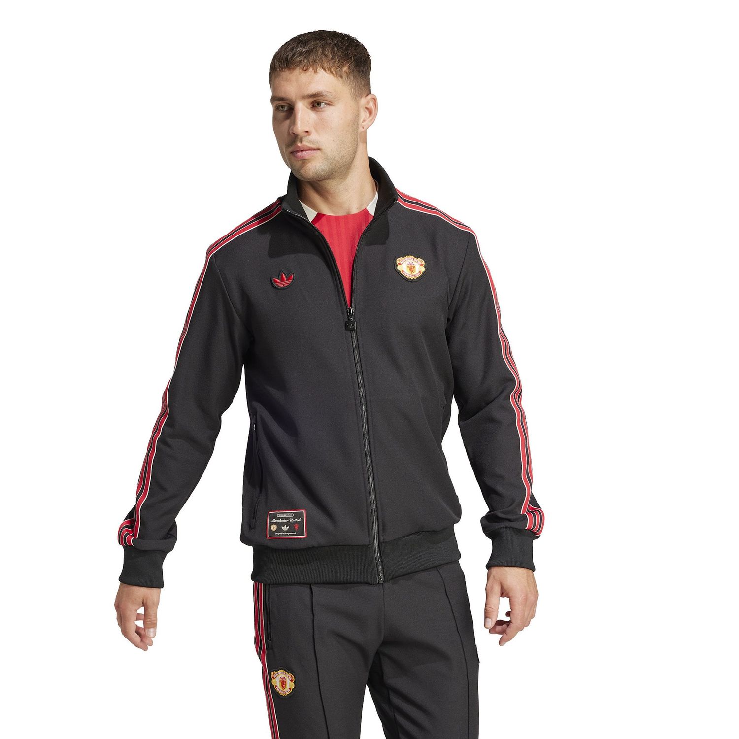 MANCHESTER UNITED 24/25 TERRACE ICONS TRACK TOP (BLACK/RED)