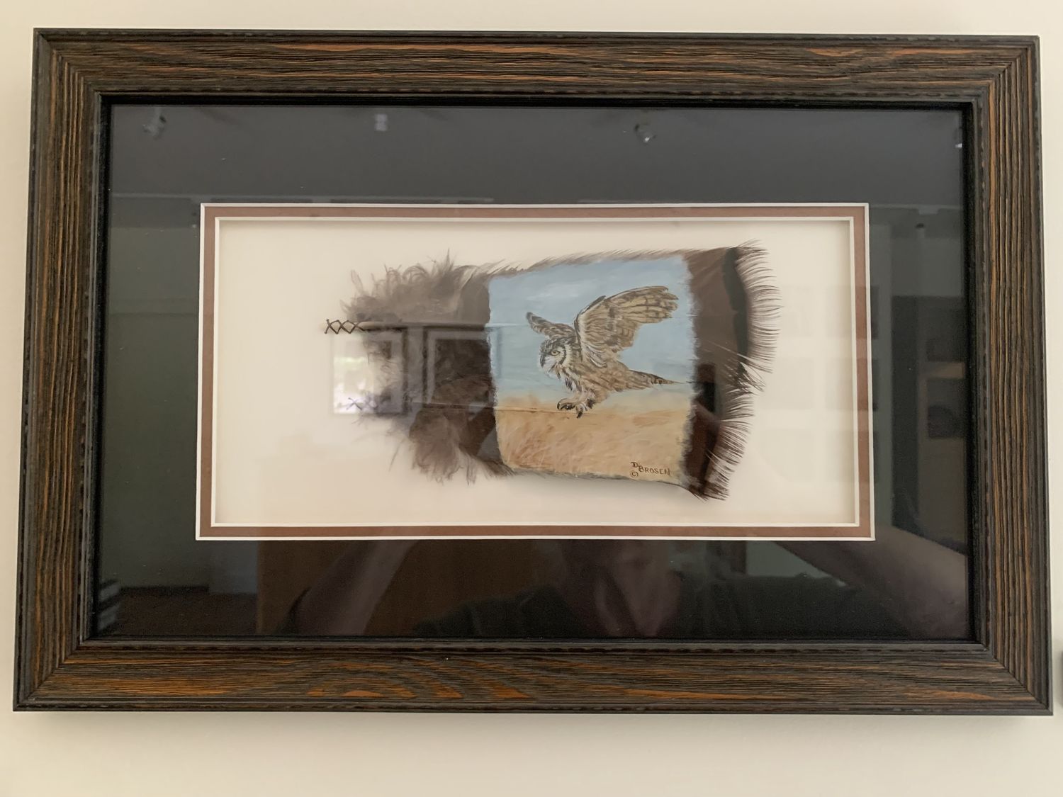 Flying owl on 2 feathers