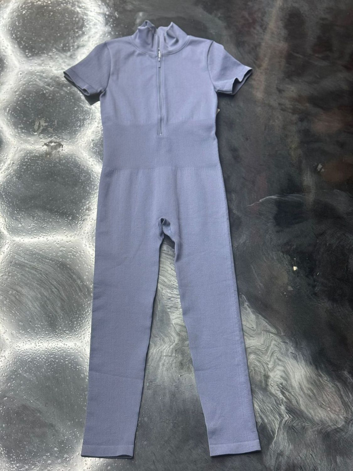 lavender open arm full body suit 