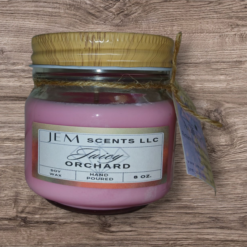Natural soy wax Juicy Orchard candle in glass jar with lid