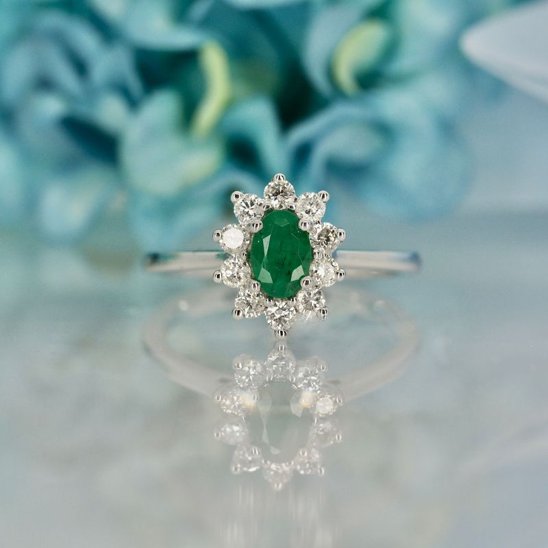 Platinum Oval Cut Emerald & Round Brilliant Cut Diamond Cluster Ring