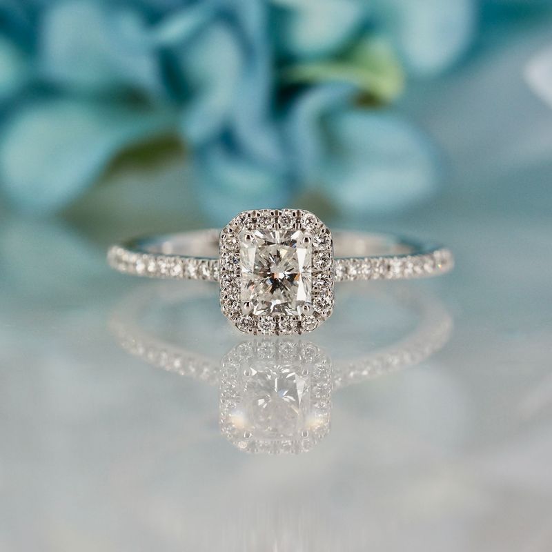 Platinum 0.70ct Emerald Cut & Round Brilliant Cut Diamond Halo Cluster Ring