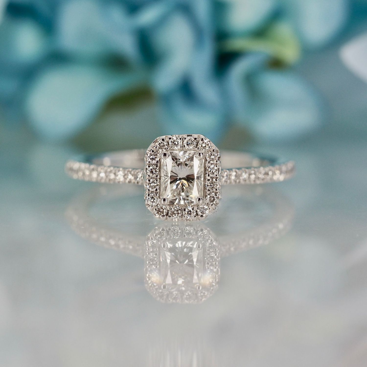 Platinum 0.54ct Emerald Cut & Round Brilliant Cut Diamond Octagonal Halo Cluster Ring