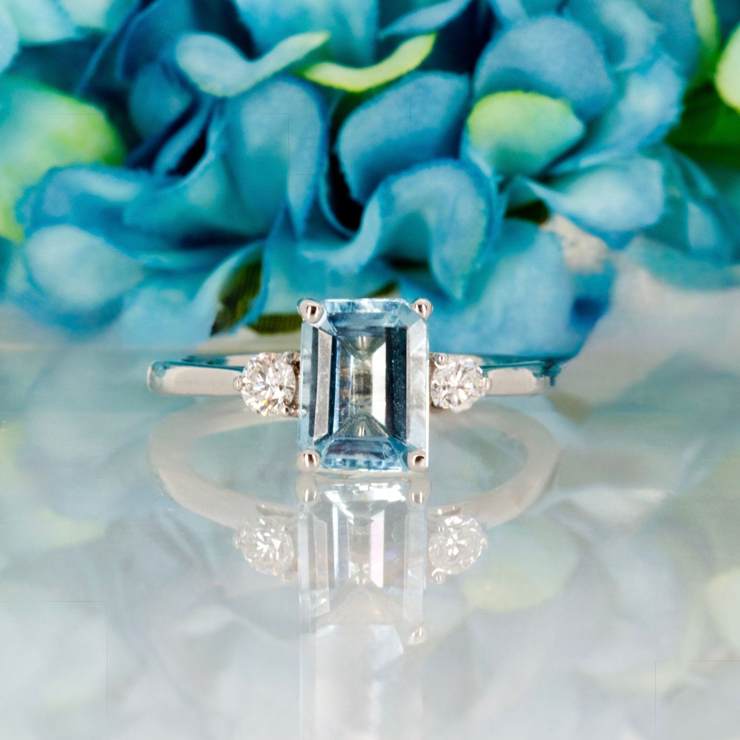 18ct White Gold Octagonal Cut Aquamarine & Round Brilliant Cut Diamond Trilogy Ring