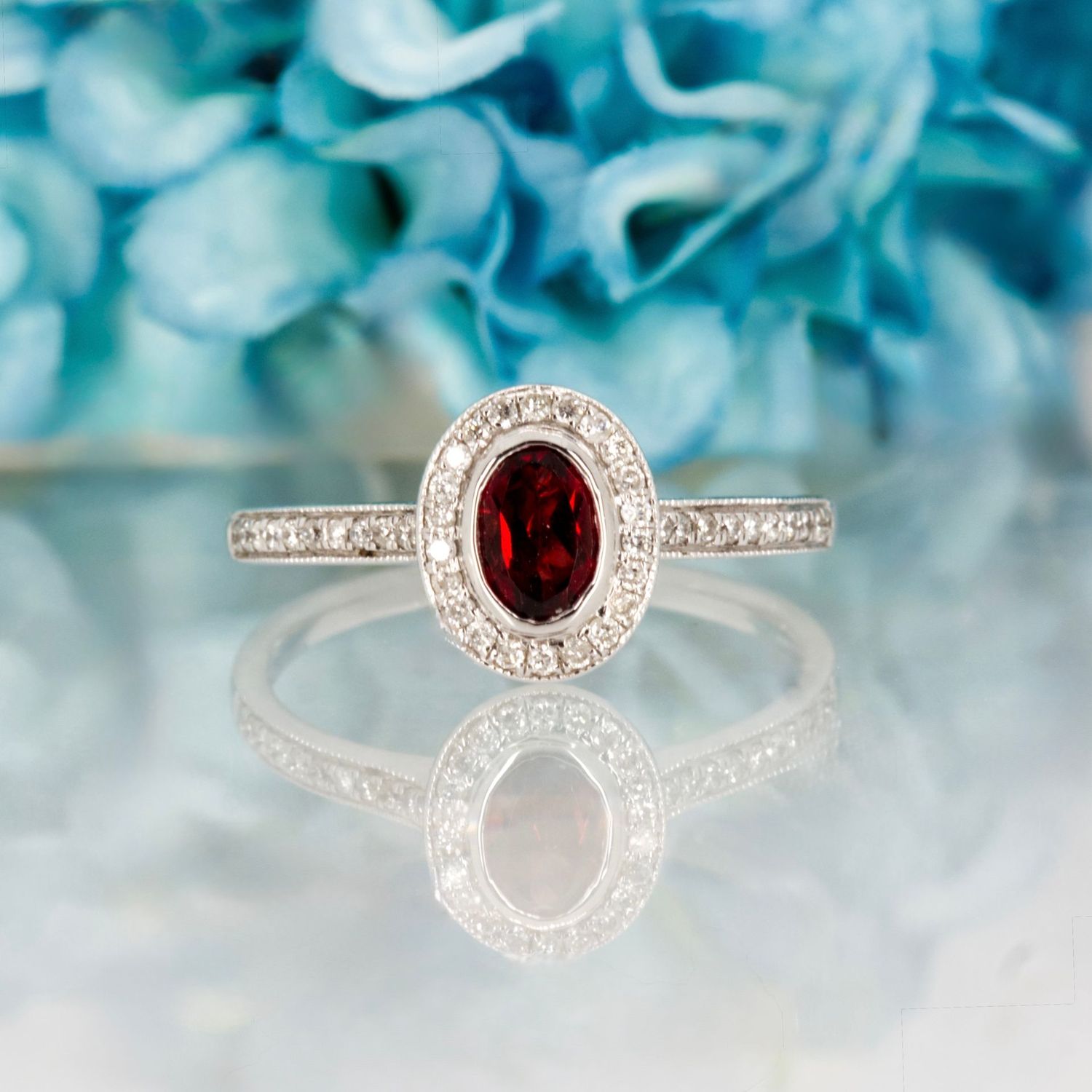 18ct White Gold Oval Cut Garnet & Round Brilliant Cut Diamond Halo Cluster Ring