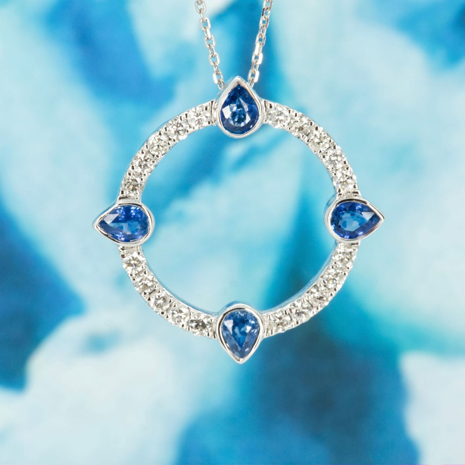 18ct White Gold Pear Cut Sapphire & Round Brilliant Cut Diamond Circle Pendant & Chain