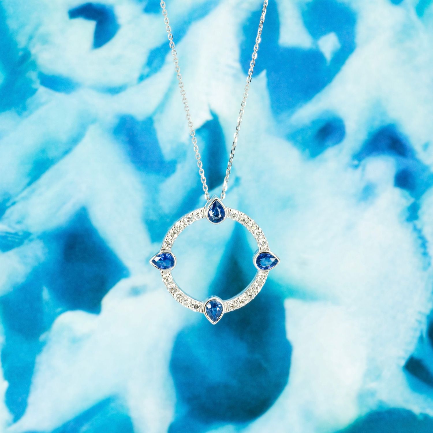 18ct White Gold Pear Cut Sapphire & Round Brilliant Cut Diamond Circle Pendant & Chain