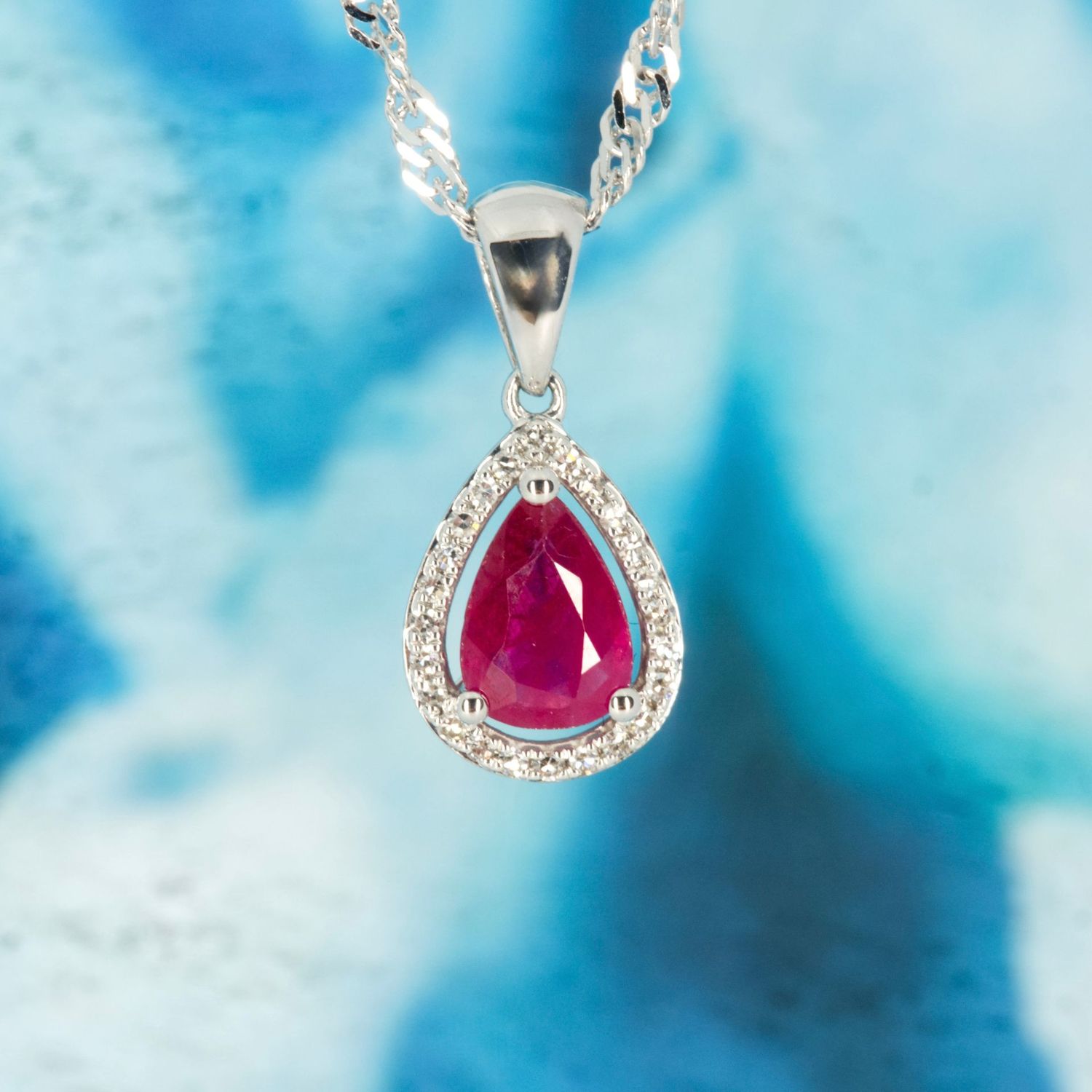 9ct White Gold Pear Cut Ruby & Round Brilliant Cut Diamond Cluster Pendant & Chain