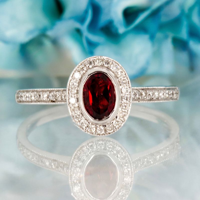 18ct White Gold Oval Cut Garnet & Round Brilliant Cut Diamond Halo Cluster Ring