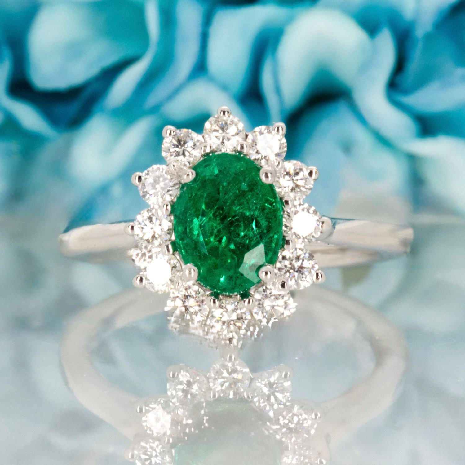 Platinum Oval Cut Emerald & Round Brilliant Cut Diamond Cluster Ring