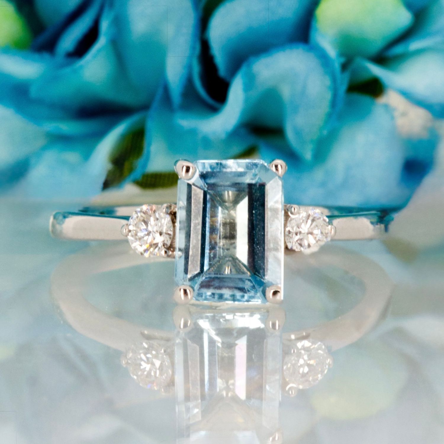 Pre-Loved 18ct White Gold Octagonal Cut Aquamarine & Round Brilliant Cut Diamond Trilogy Ring