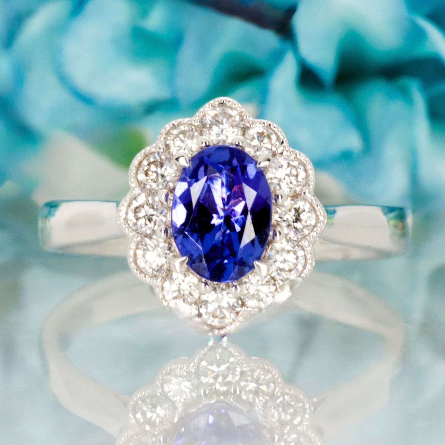18ct White Gold Oval Cut Tanzanite & Round Brilliant Cut Diamond Cluster Ring