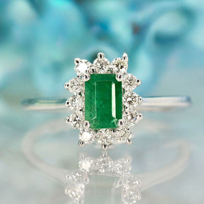 Platinum Rectangular Cut Emerald & Round Brilliant Cut Diamond Cluster Ring
