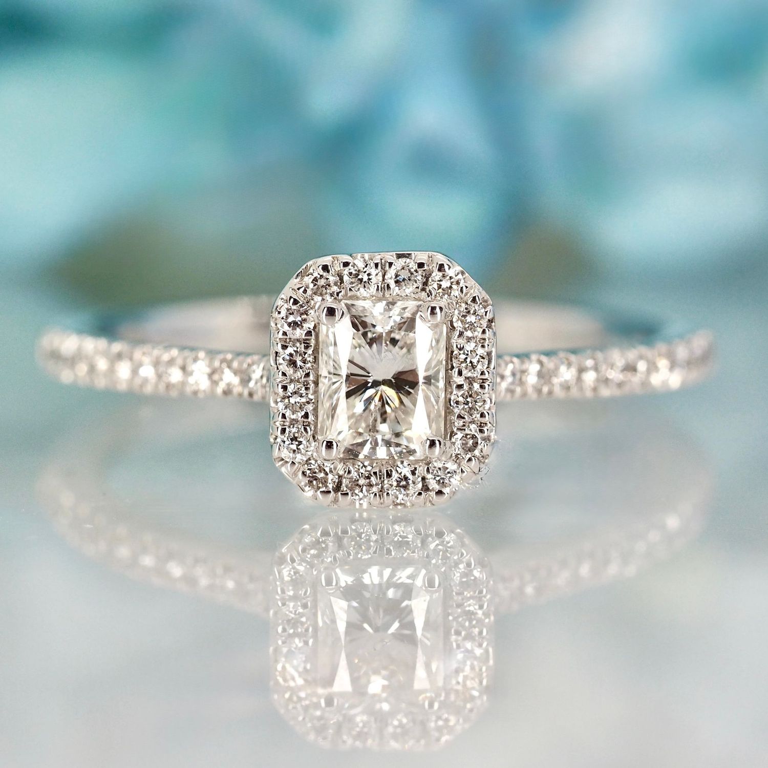 Platinum 0.54ct Emerald Cut & Round Brilliant Cut Diamond Octagonal Halo Cluster Ring