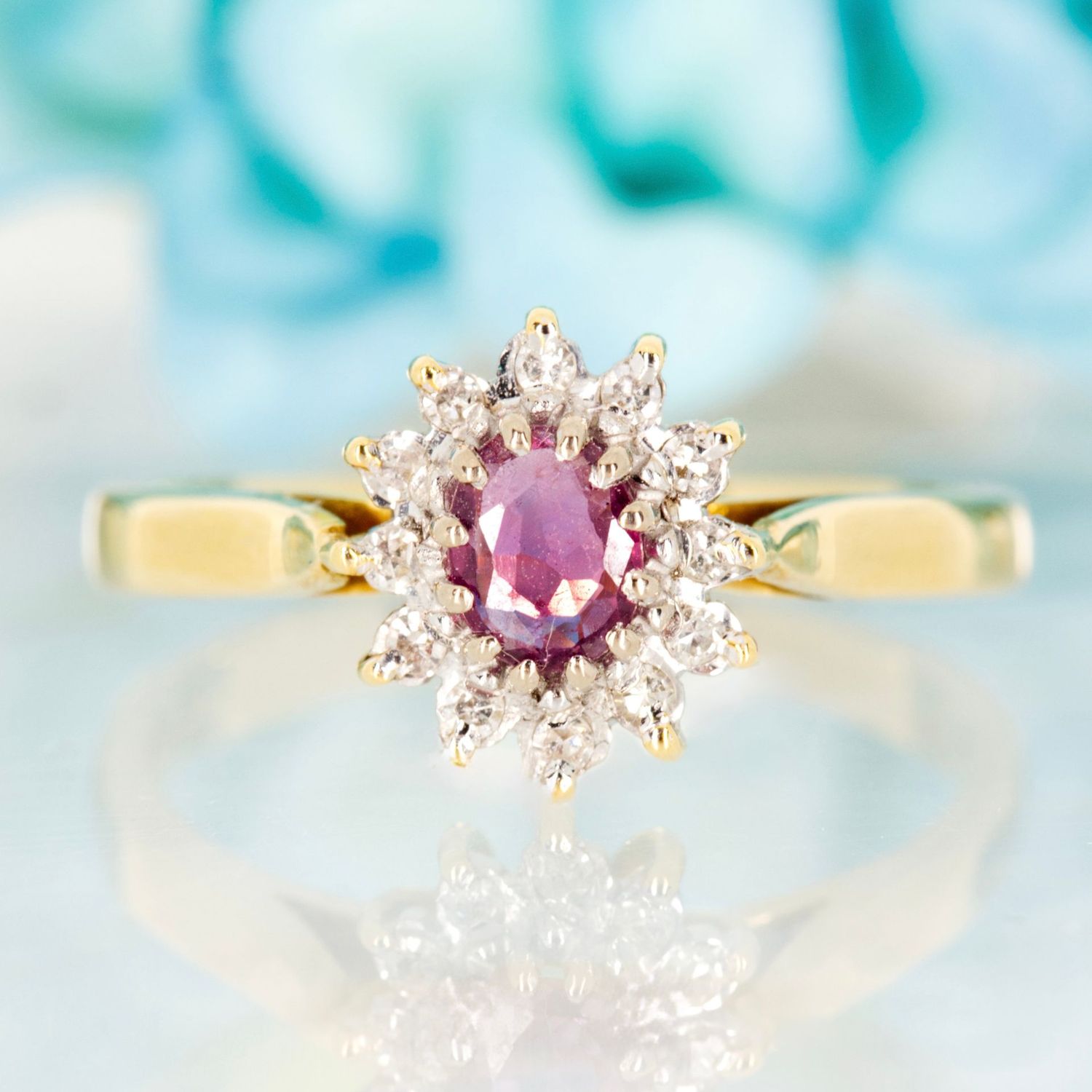 Pre-Loved 18ct Yellow Gold Oval Cut Ruby & Round Brilliant Cut Diamond Cluster Ring
