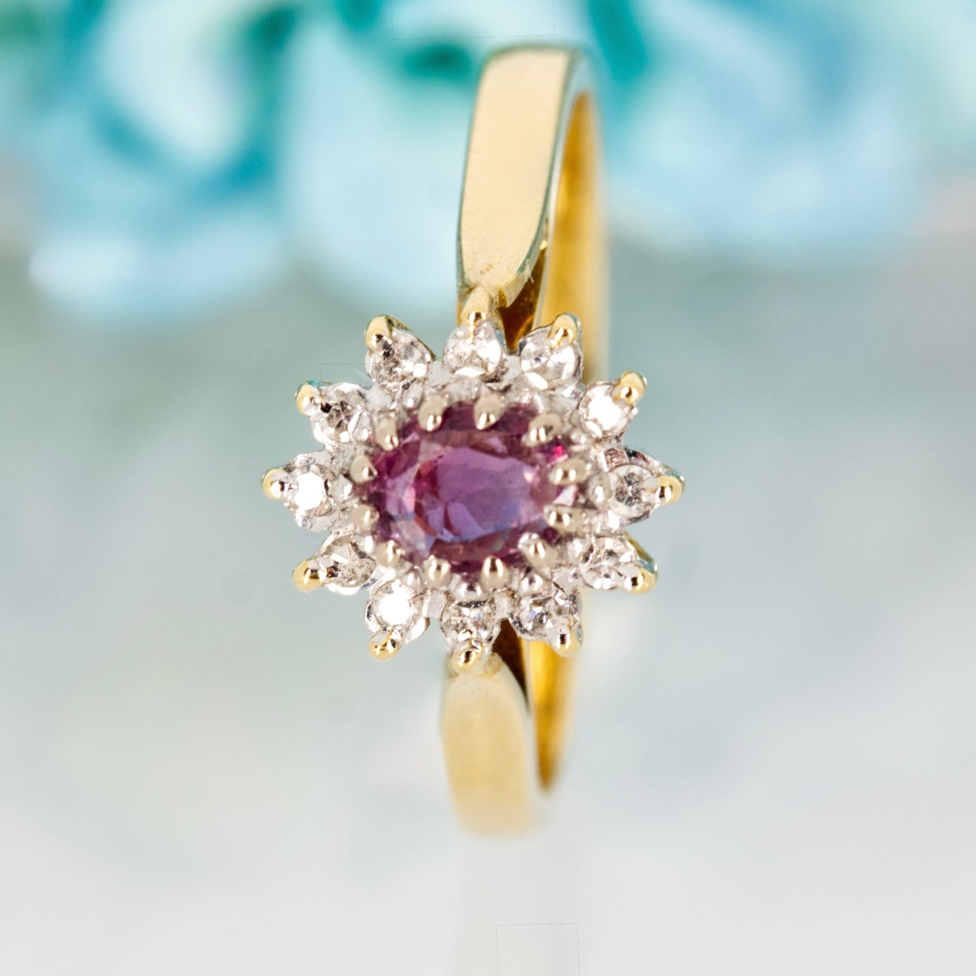Pre-Loved 18ct Yellow Gold Oval Cut Ruby & Round Brilliant Cut Diamond Cluster Ring