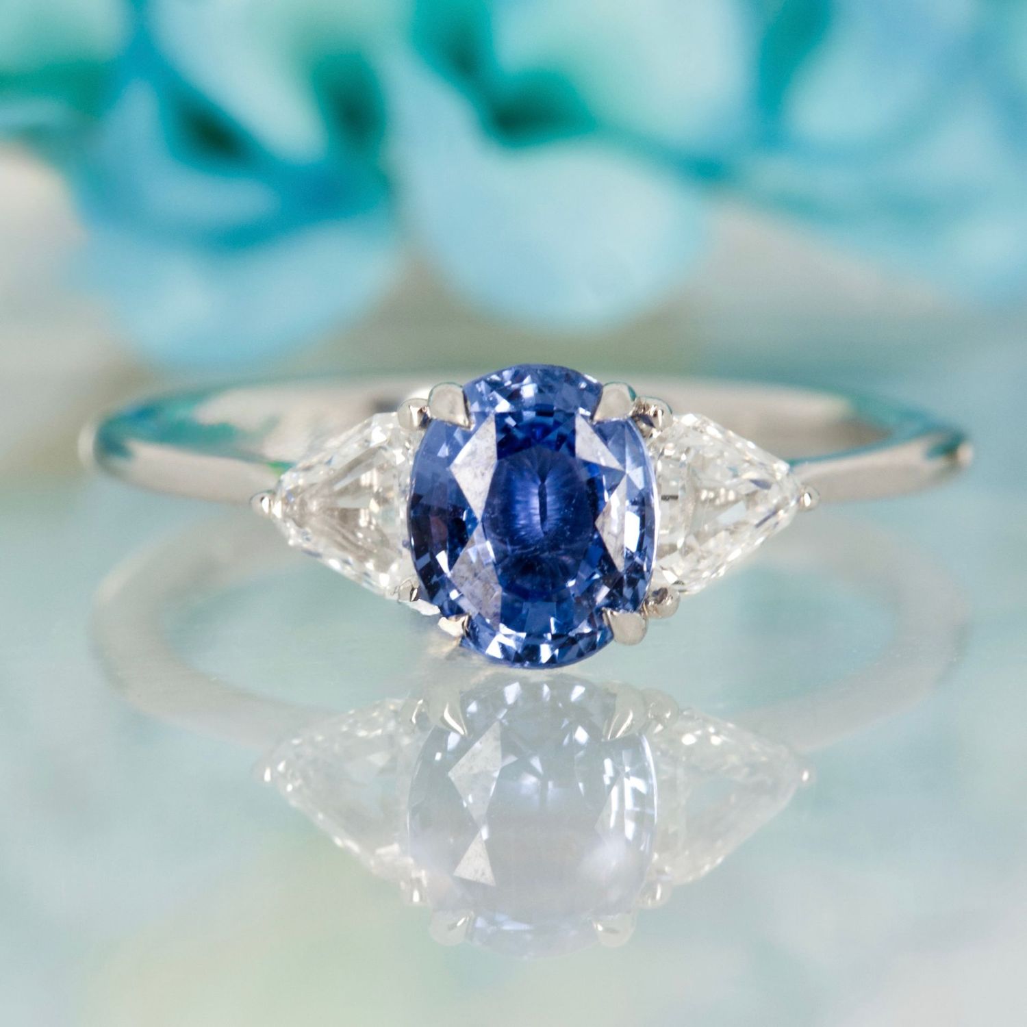 Platinum Oval Cut Sapphire & Trilliant Cut Diamond Trilogy Ring