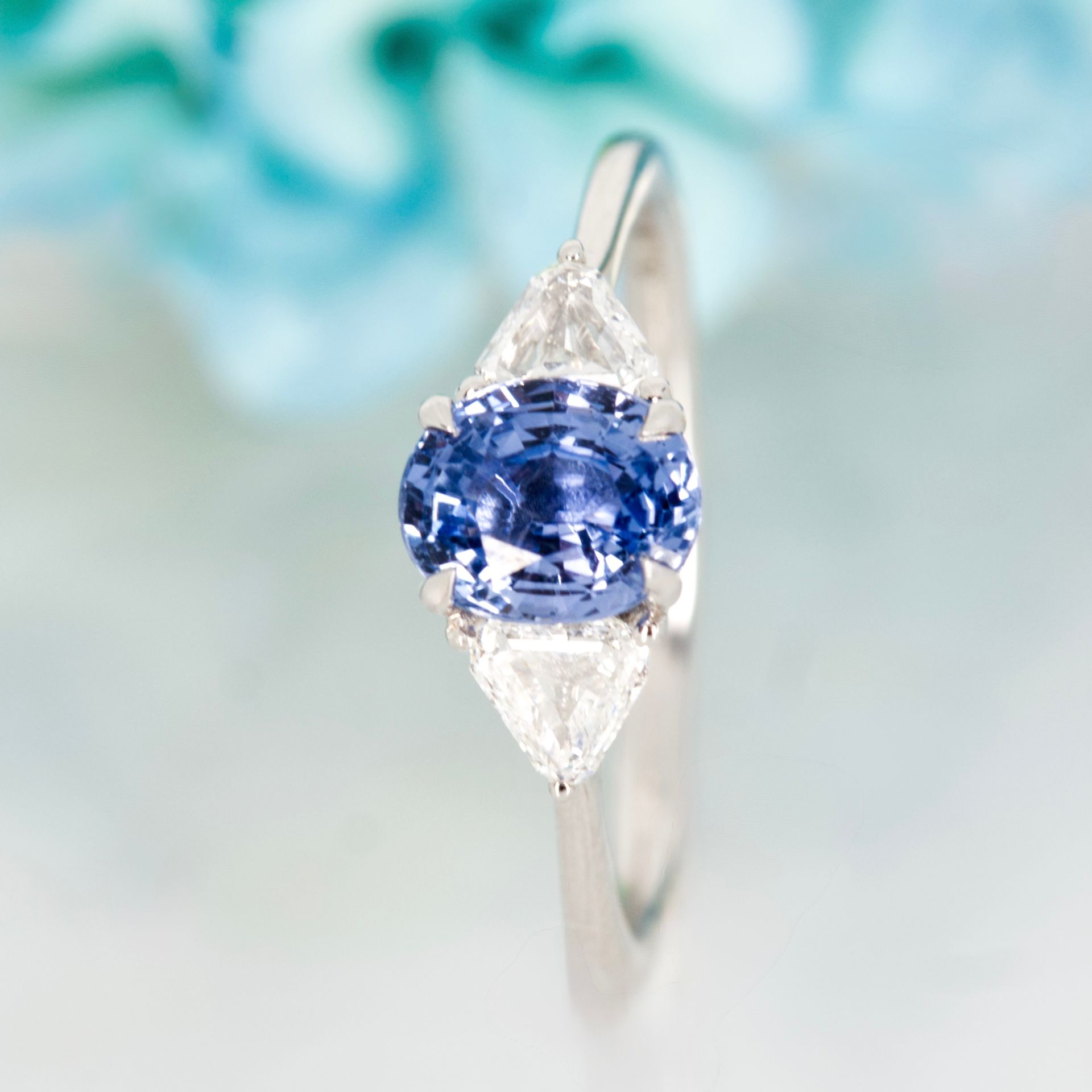 Platinum Oval Cut Sapphire & Trilliant Cut Diamond Trilogy Ring