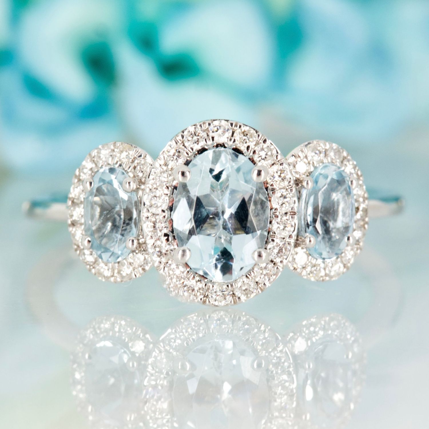 9ct White Gold Oval Cut Aquamarine & Round Brilliant Cut Diamond Triple Halo Cluster Ring