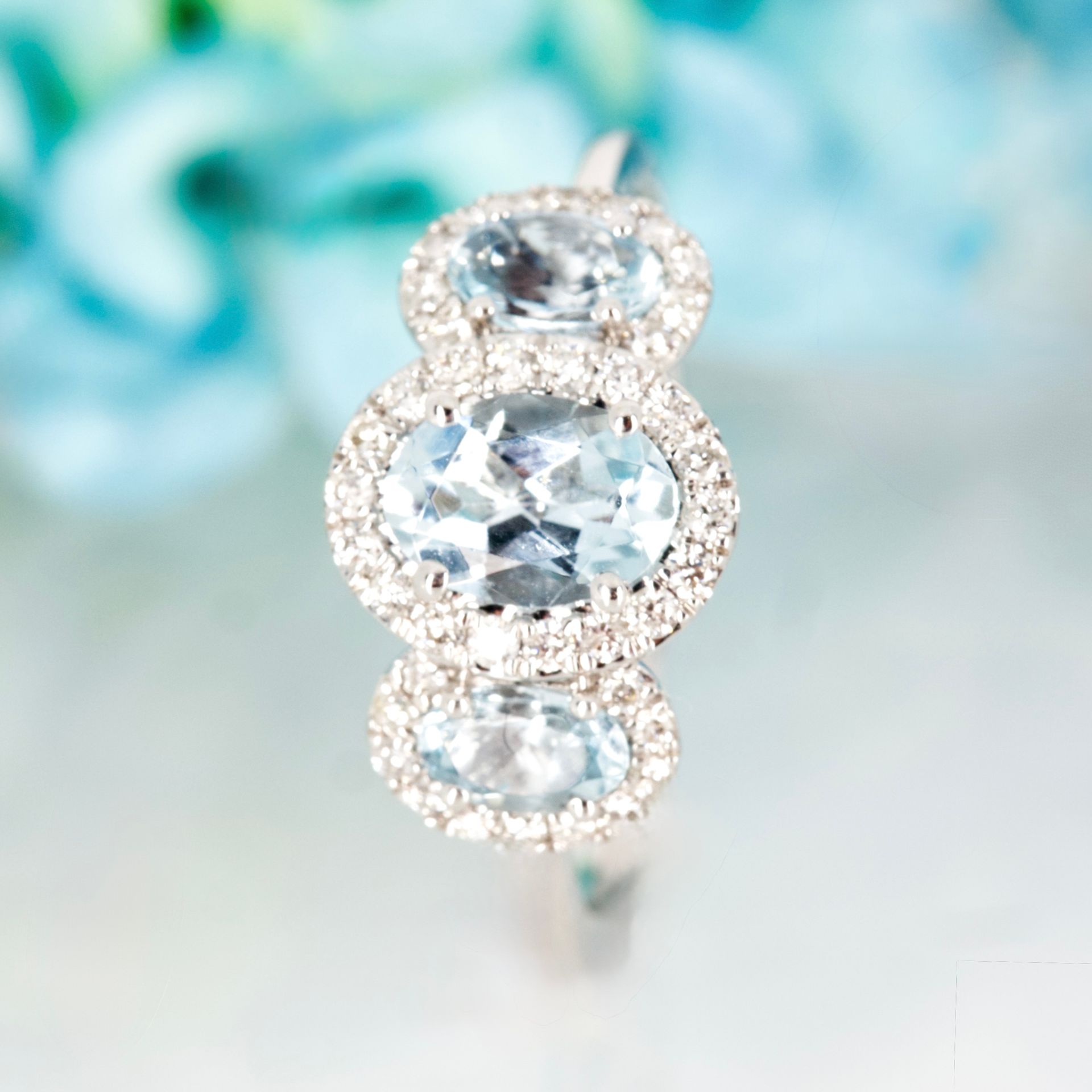9ct White Gold Oval Cut Aquamarine & Round Brilliant Cut Diamond Triple Halo Cluster Ring