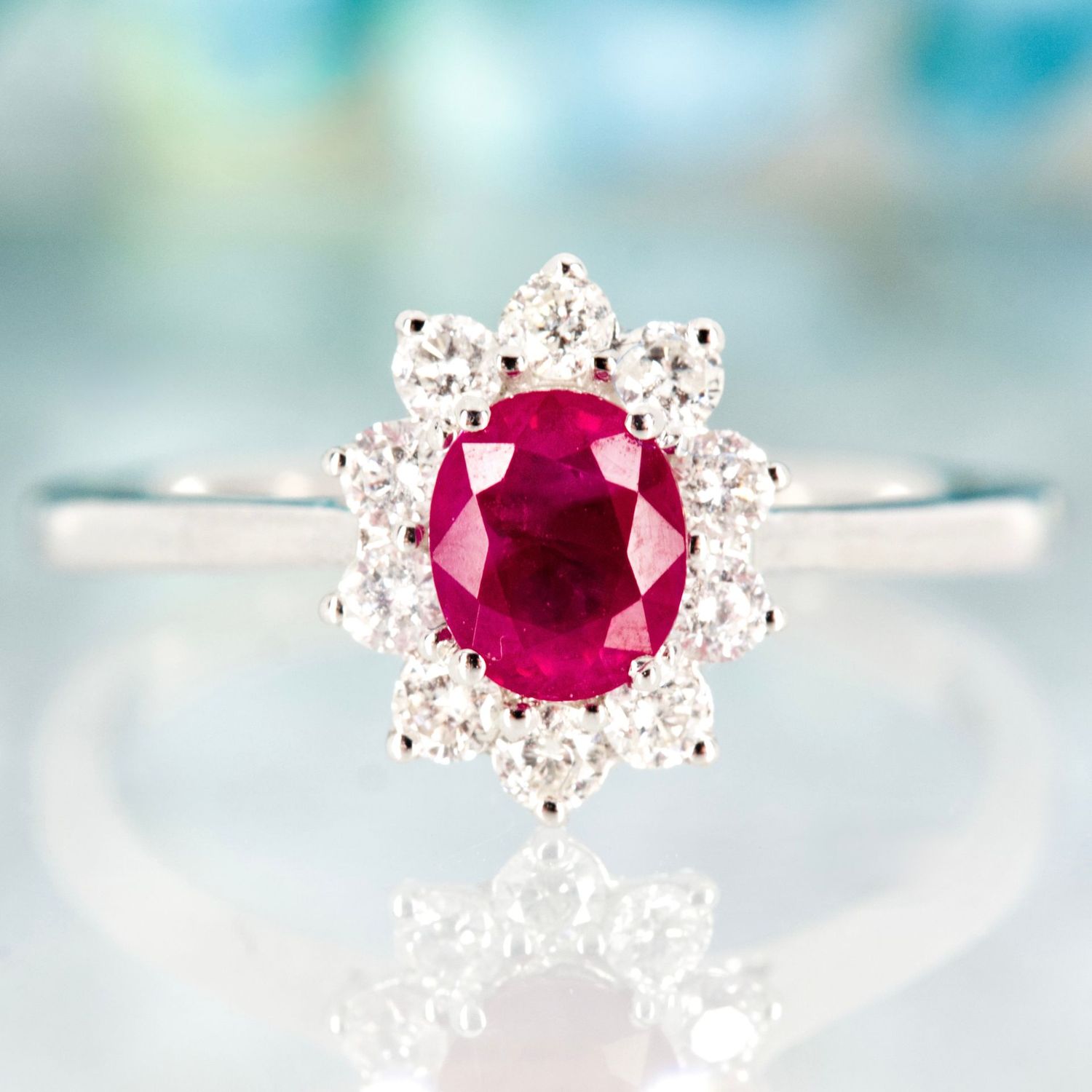 18ct White Gold Oval Cut Ruby & Round Brilliant Cut Diamond Cluster Ring