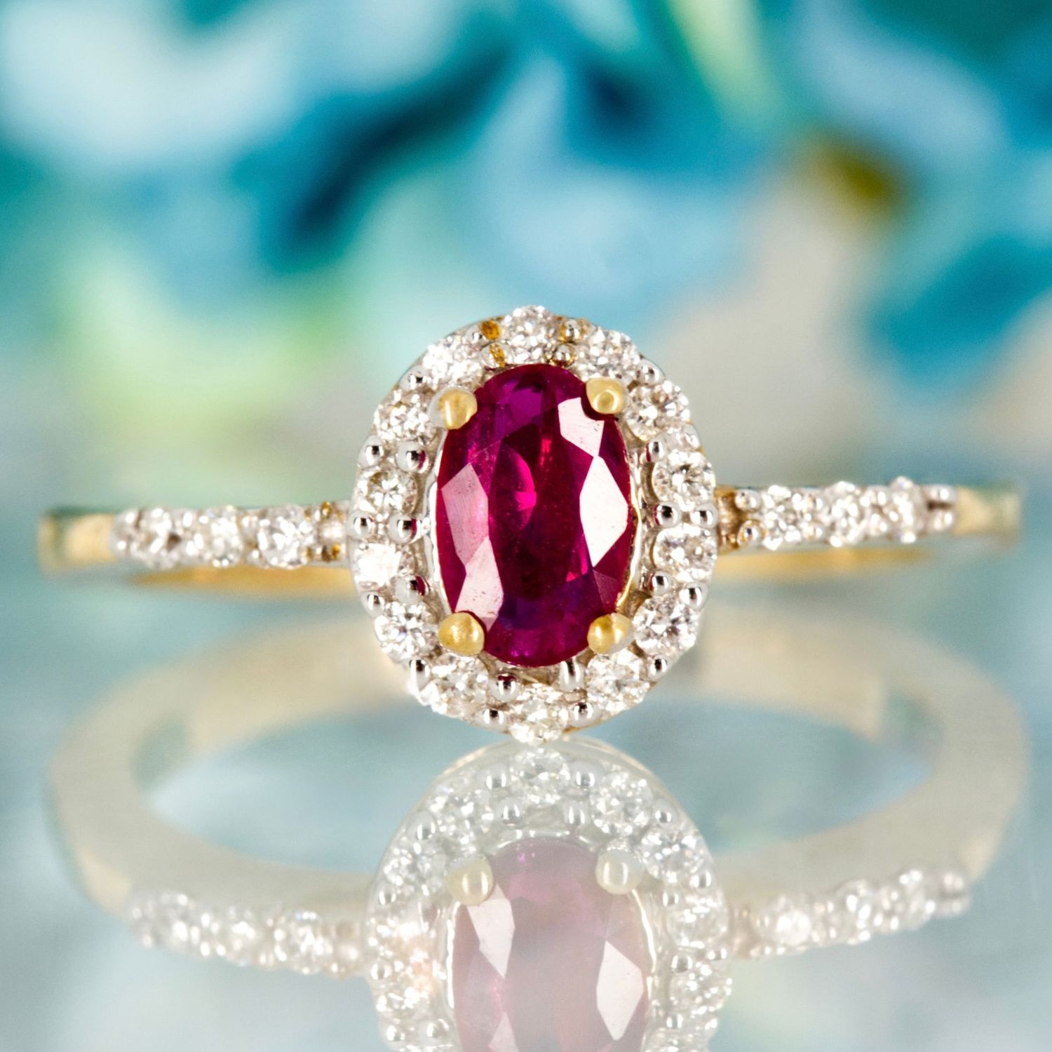9ct Yellow Gold Oval Cut Ruby & Round Brilliant Cut Diamond Halo Cluster Ring