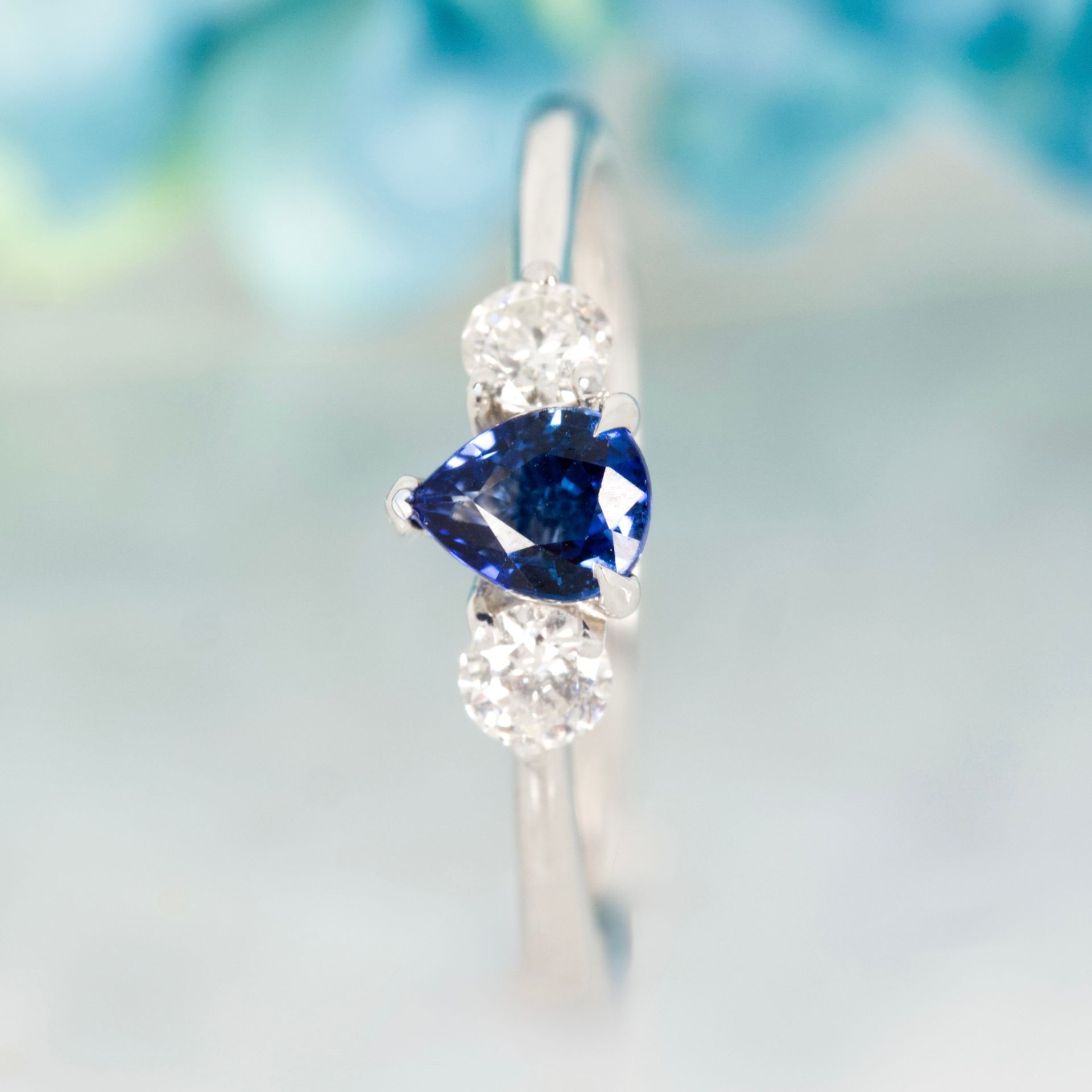 Platinum Pear Cut Sapphire & Round Brilliant Cut Diamond Trilogy Ring