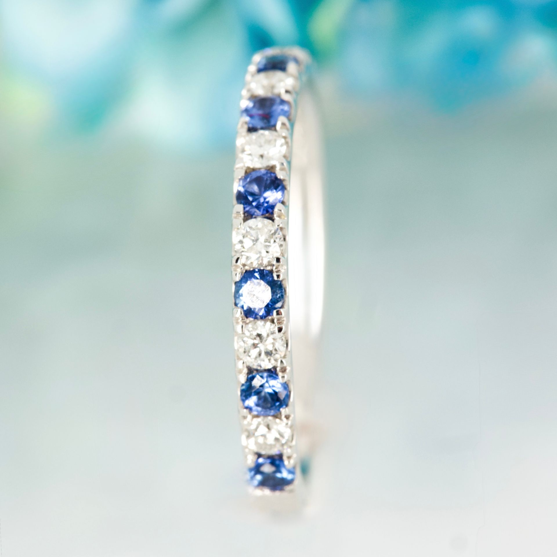 Platinum Round Cut Sapphire & Diamond Claw Set Half Eternity Ring