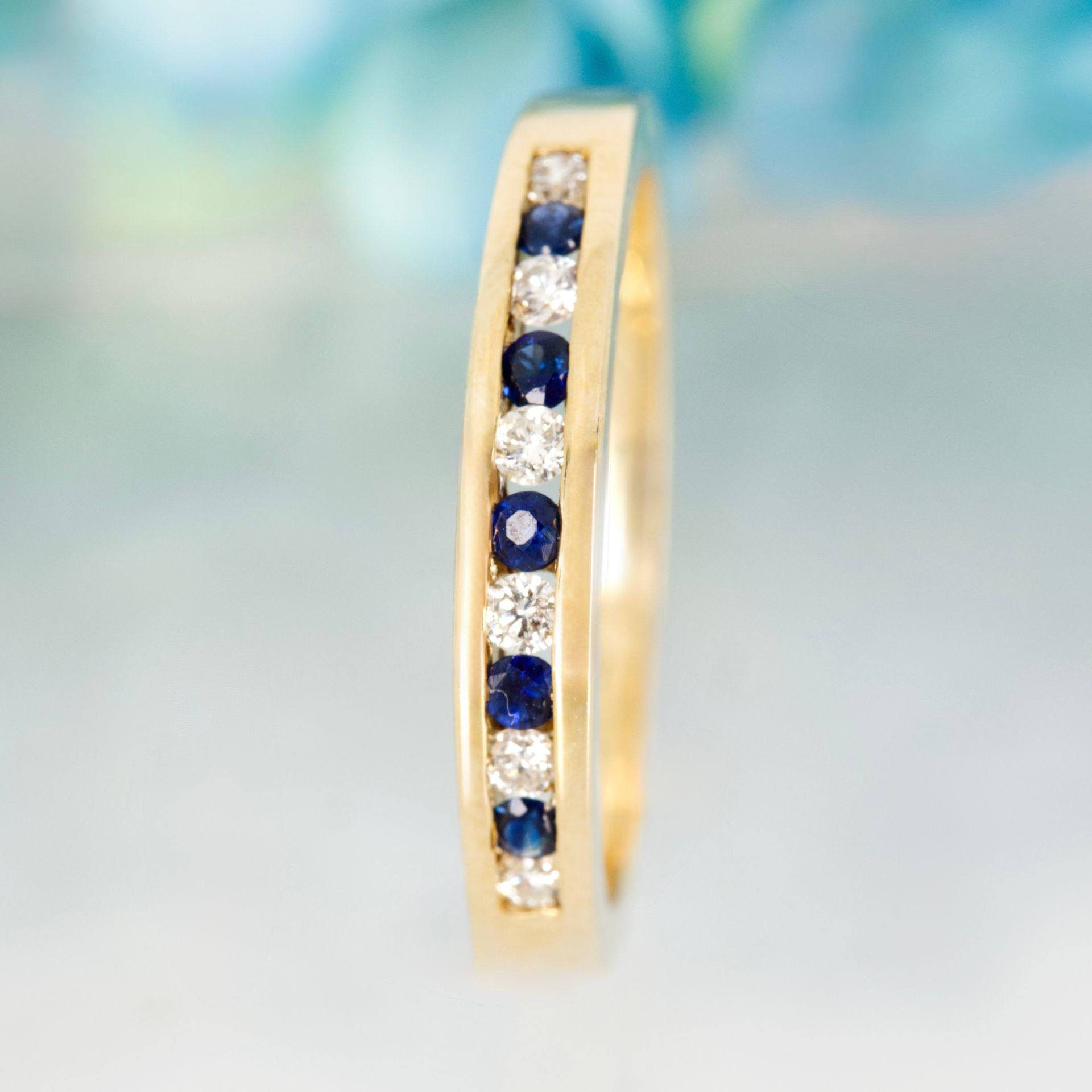 9ct Yellow Gold Round Cut Sapphire & Diamond Channel Set Half Eternity Ring