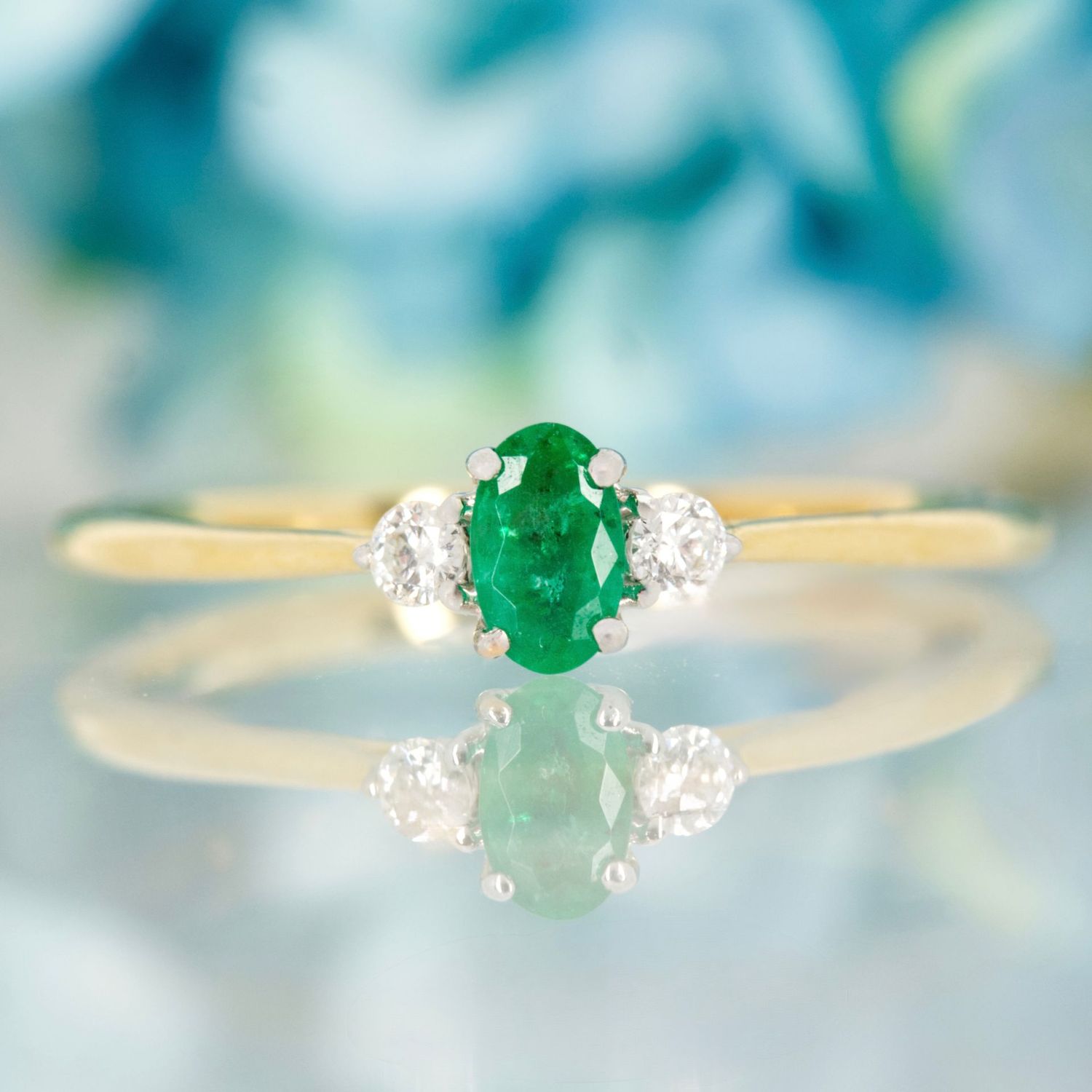 18ct Yellow Gold Ova Cut Emerald & Round Brilliant Cut Diamond Trilogy Ring