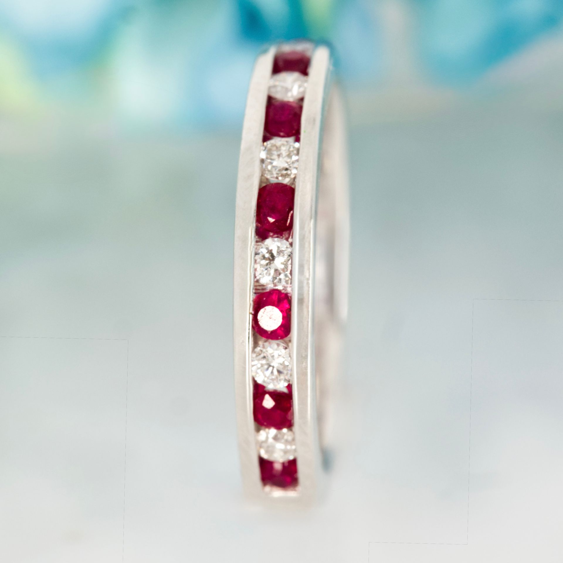 Platinum Round Cut Ruby & Diamond Channel Set Half Eternity Ring