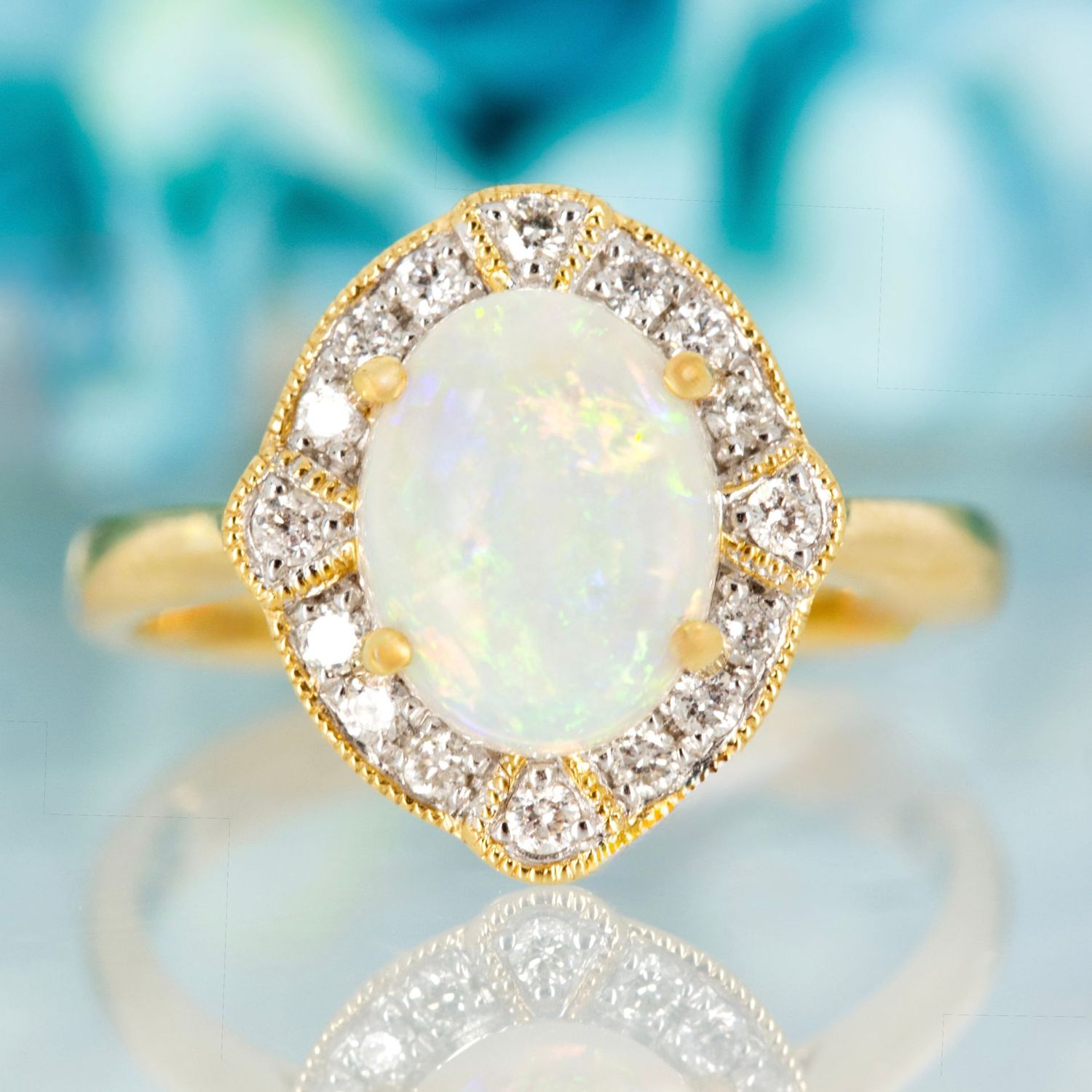 18ct Yellow Gold Oval Shaped Opal & Round Brilliant Cut Diamond Cluster Ring