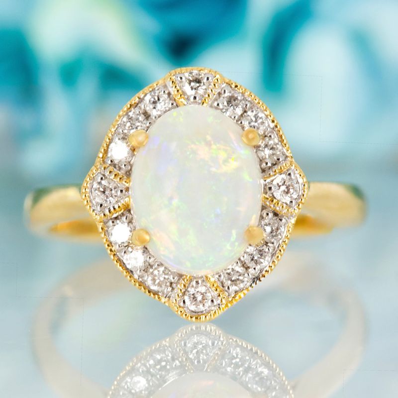 18ct Yellow Gold Oval Shaped Opal & Round Brilliant Cut Diamond Cluster Ring