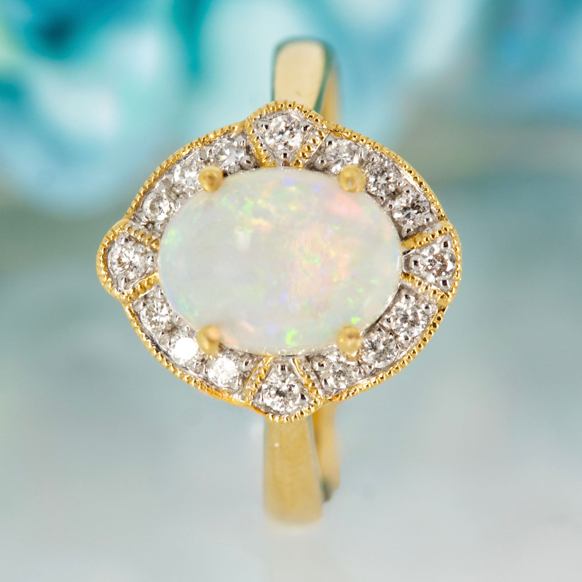 18ct Yellow Gold Oval Shaped Opal & Round Brilliant Cut Diamond Cluster Ring