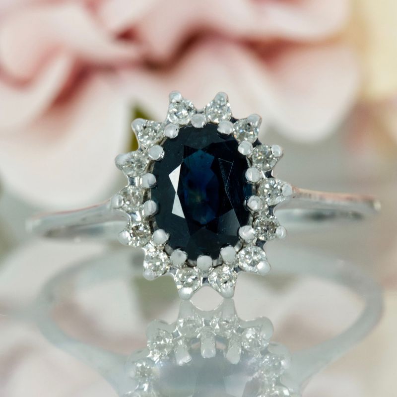 Pre-Loved 9ct White Gold Oval Cut Sapphire & Round Brilliant Cut Diamond Cluster Ring