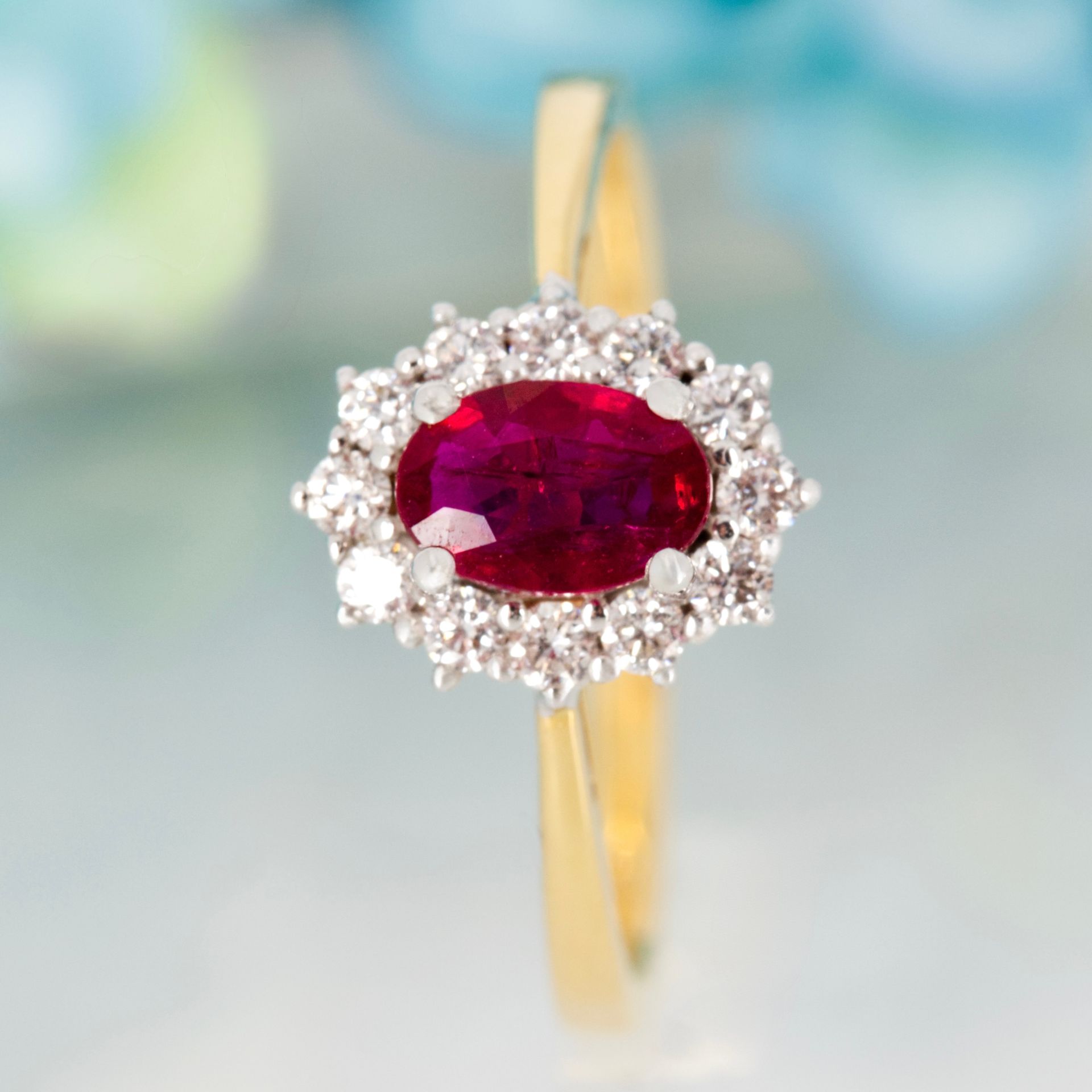 18ct Yellow Gold Oval Cut Ruby & Round Brilliant Cut Diamond Cluster Ring