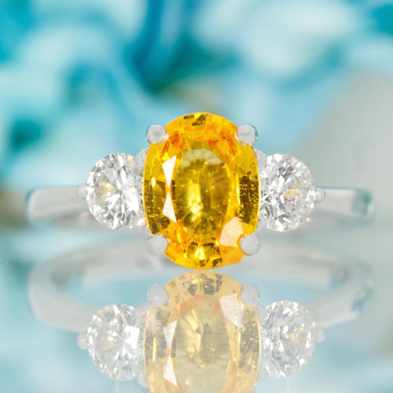 Platinum Oval Cut Yellow Sapphire & Round Brilliant Cut Diamond Trilogy Ring