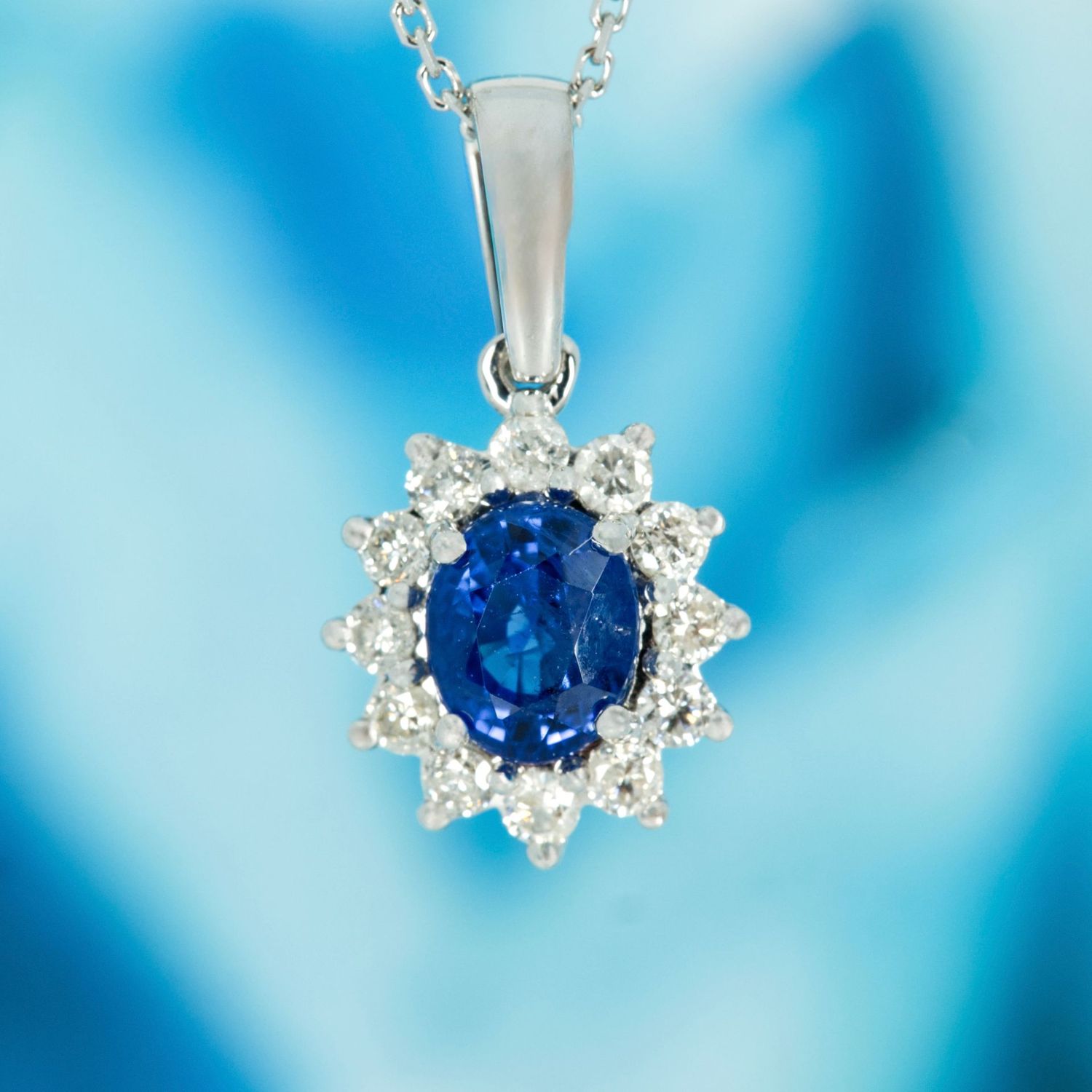 9ct White Gold Oval Cut Sapphire & Round Brilliant Cut Diamond Cluster Pendant & Chain