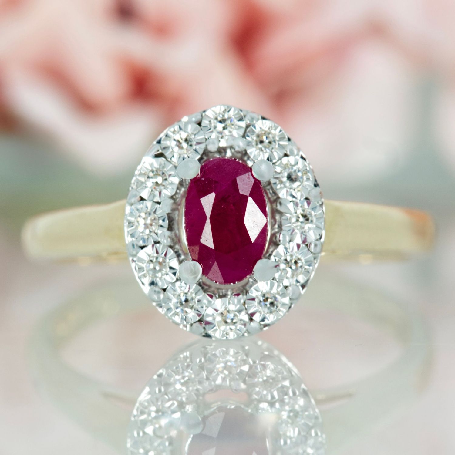 9ct Yellow Gold Oval Cut Ruby & Round Brilliant Cut Diamond Halo Cluster Ring