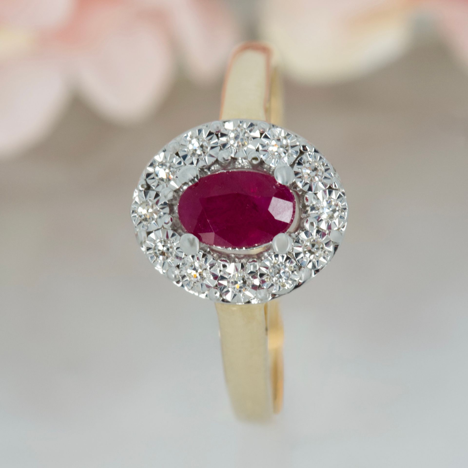 9ct Yellow Gold Oval Cut Ruby & Round Brilliant Cut Diamond Halo Cluster Ring