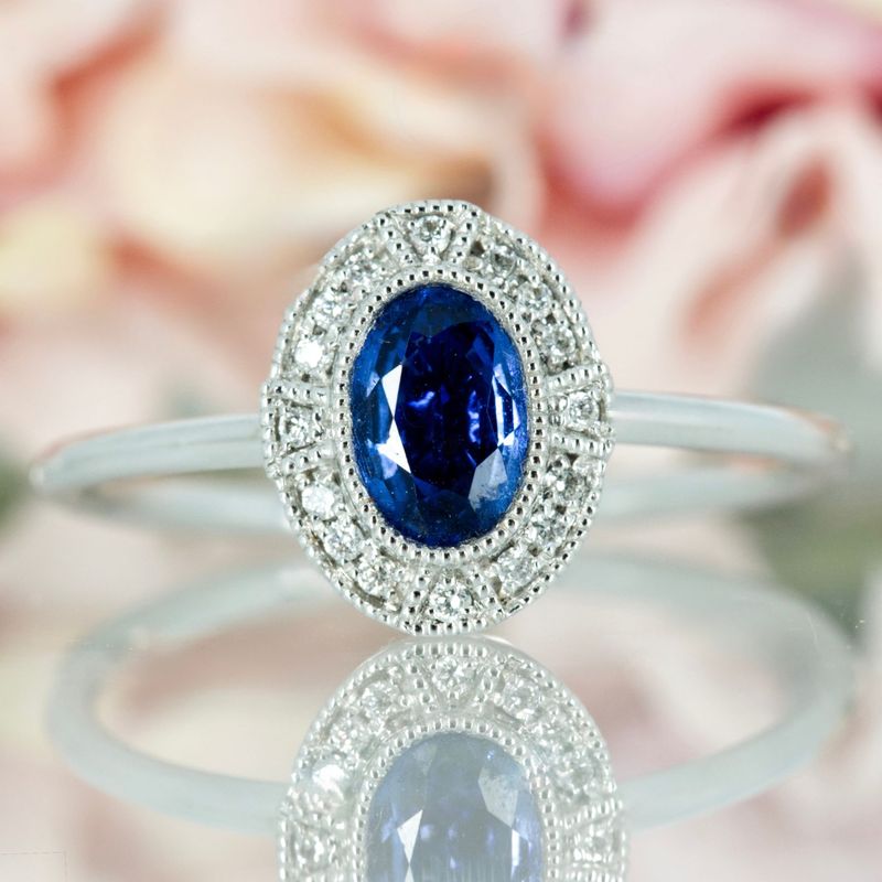 18ct White Gold Oval Cut Sapphire & Round Brilliiant Cut Diamond Halo Cluster Ring