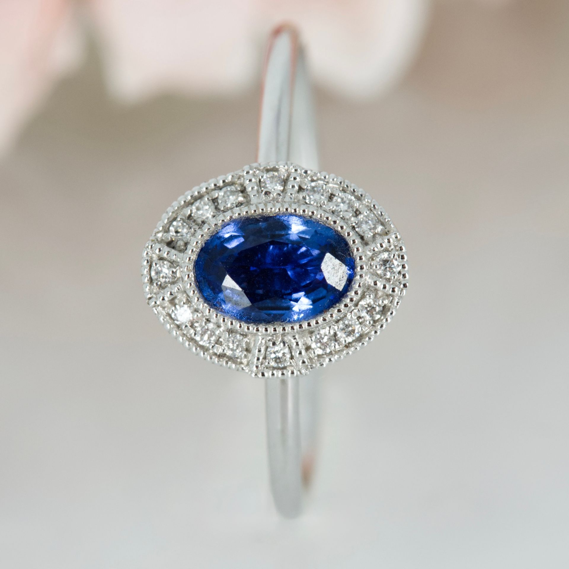 18ct White Gold Oval Cut Sapphire & Round Brilliiant Cut Diamond Halo Cluster Ring