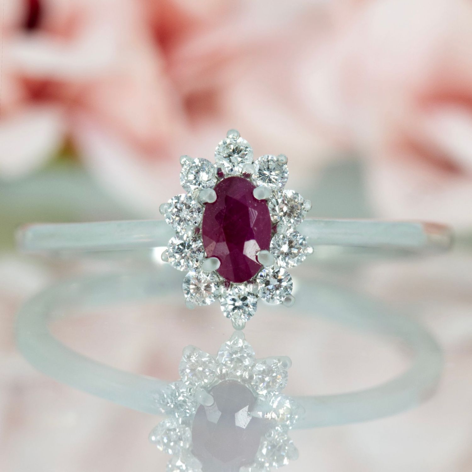 Platinum Oval Cut Ruby & Round Brilliant Cut Diamond Cluster Ring Platinum Oval Cut Ruby & Round Brilliant Cut Diamond Cluster Ring